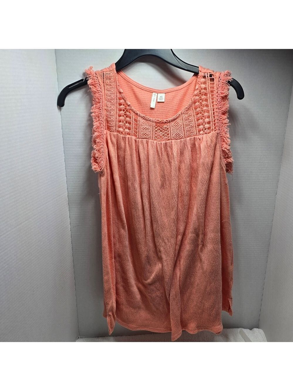 Elegant Sleeveless Coral Blouse with Crochet Accents